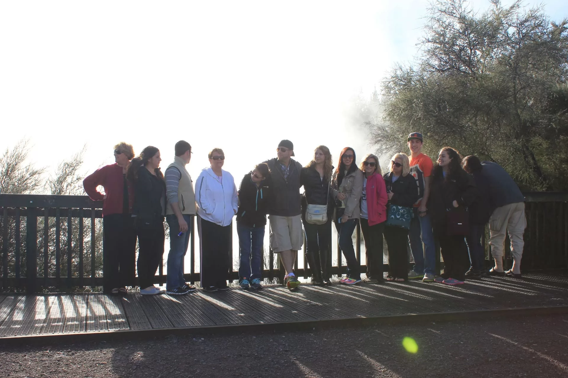group travel in front of geothermal walkway