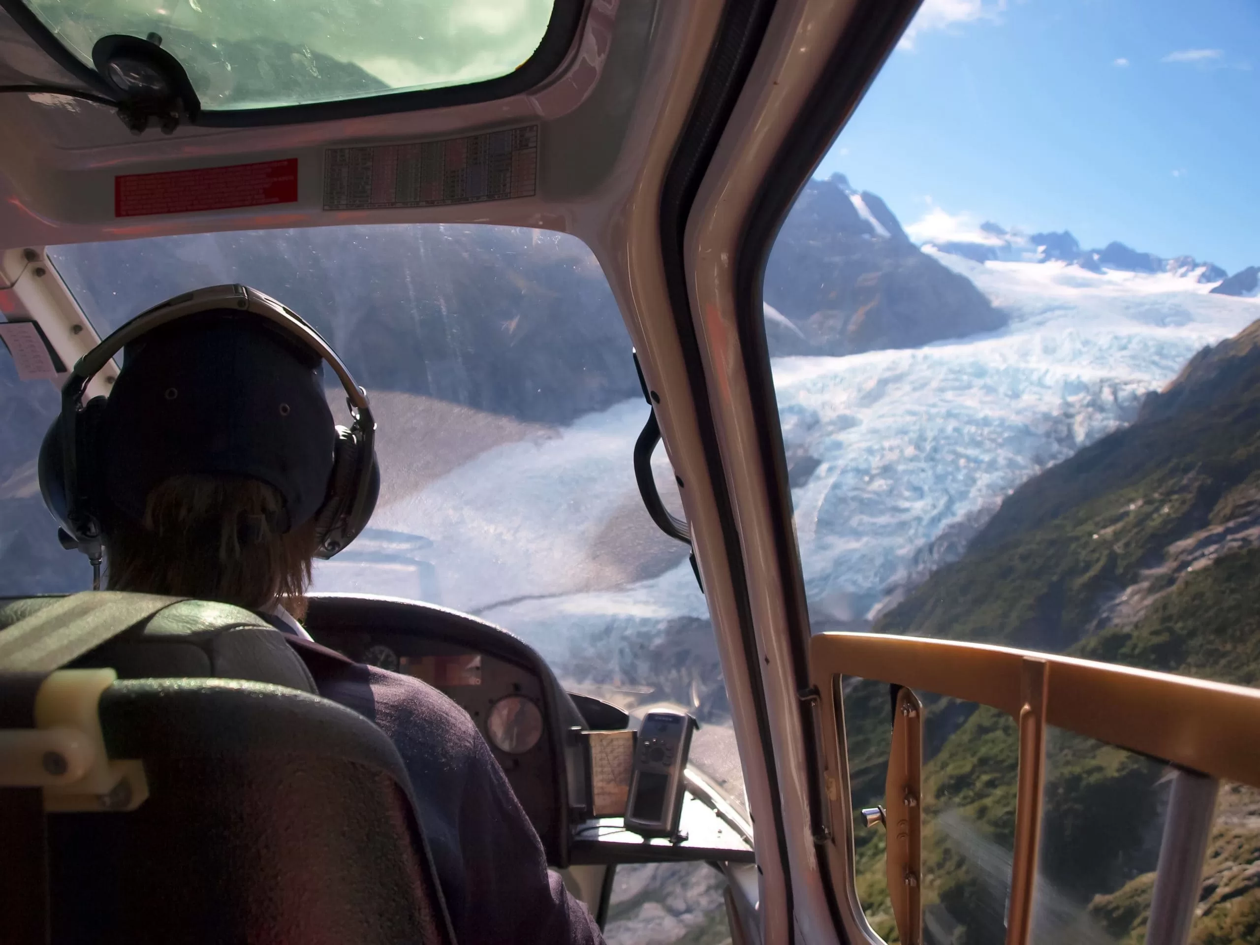 helicopter over glacier